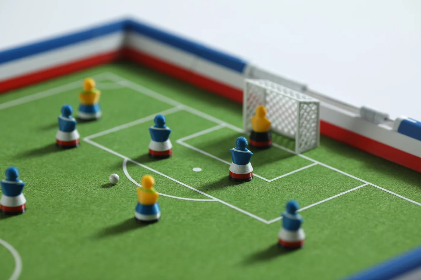 Detail view of a Footballec attack in front of goal with a French sideboard