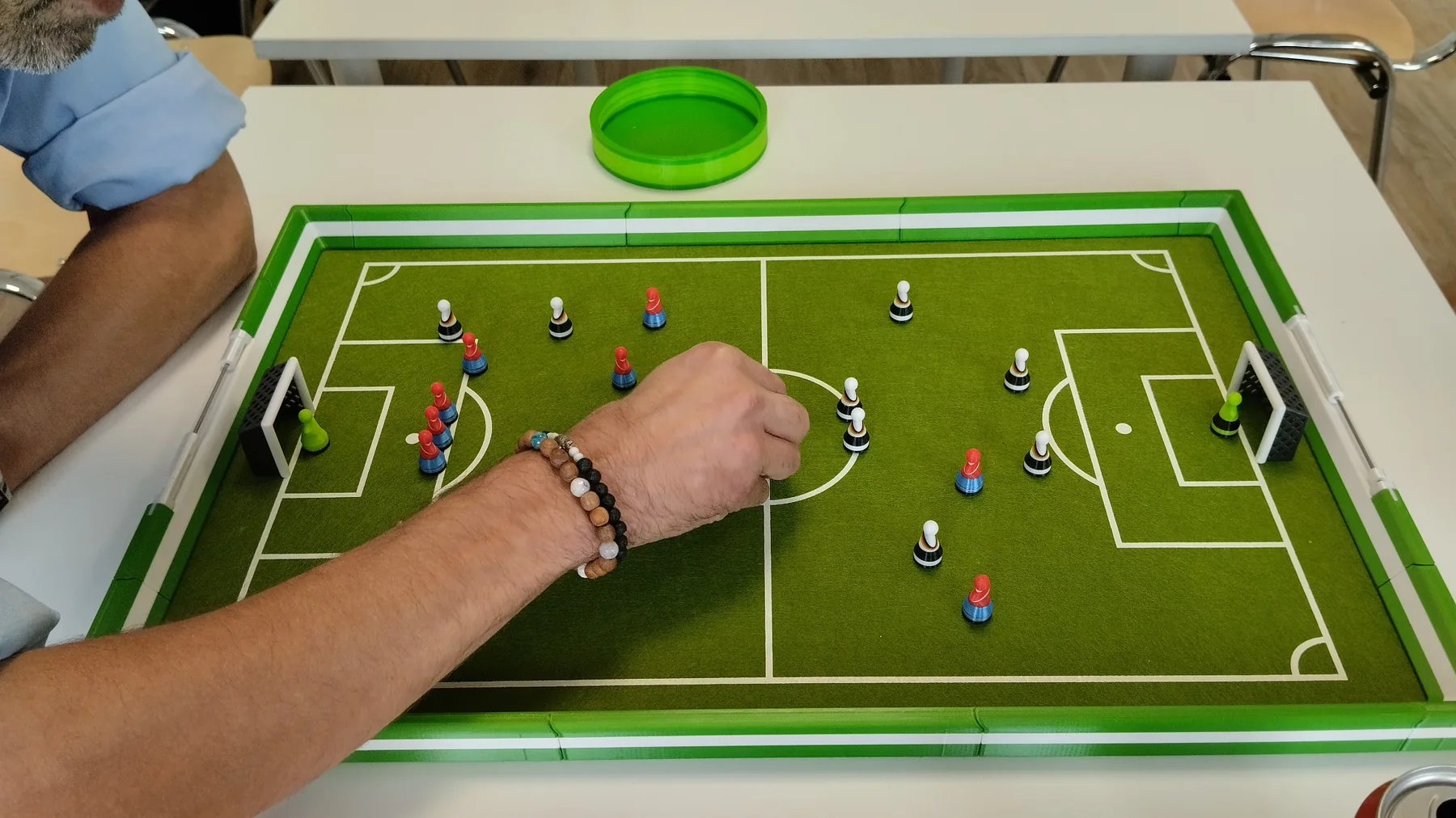 Hand directly over the Footballec pitch