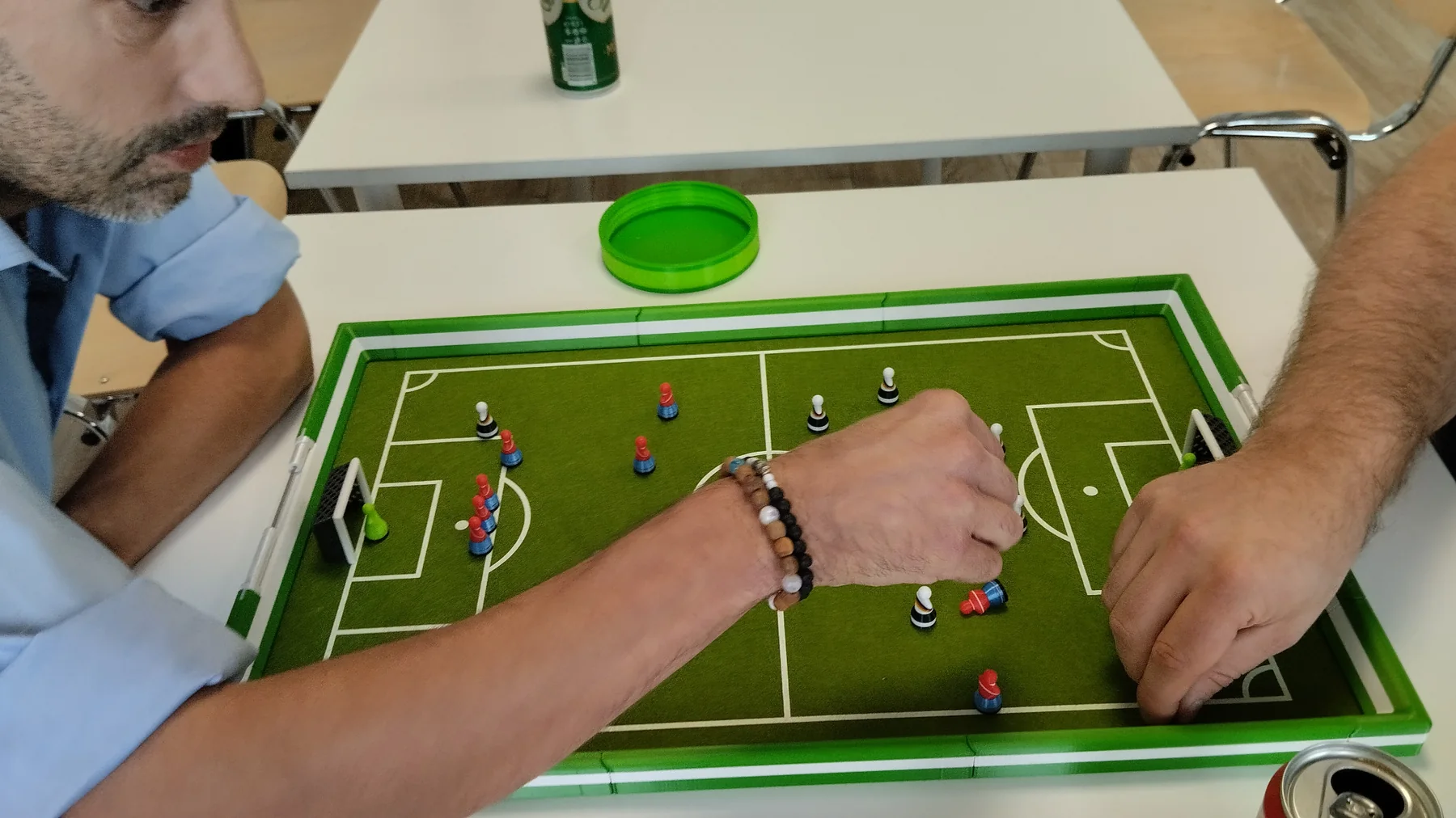 Two hands in a direct Footballec duel